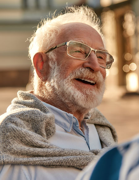 Older bearded man smiling